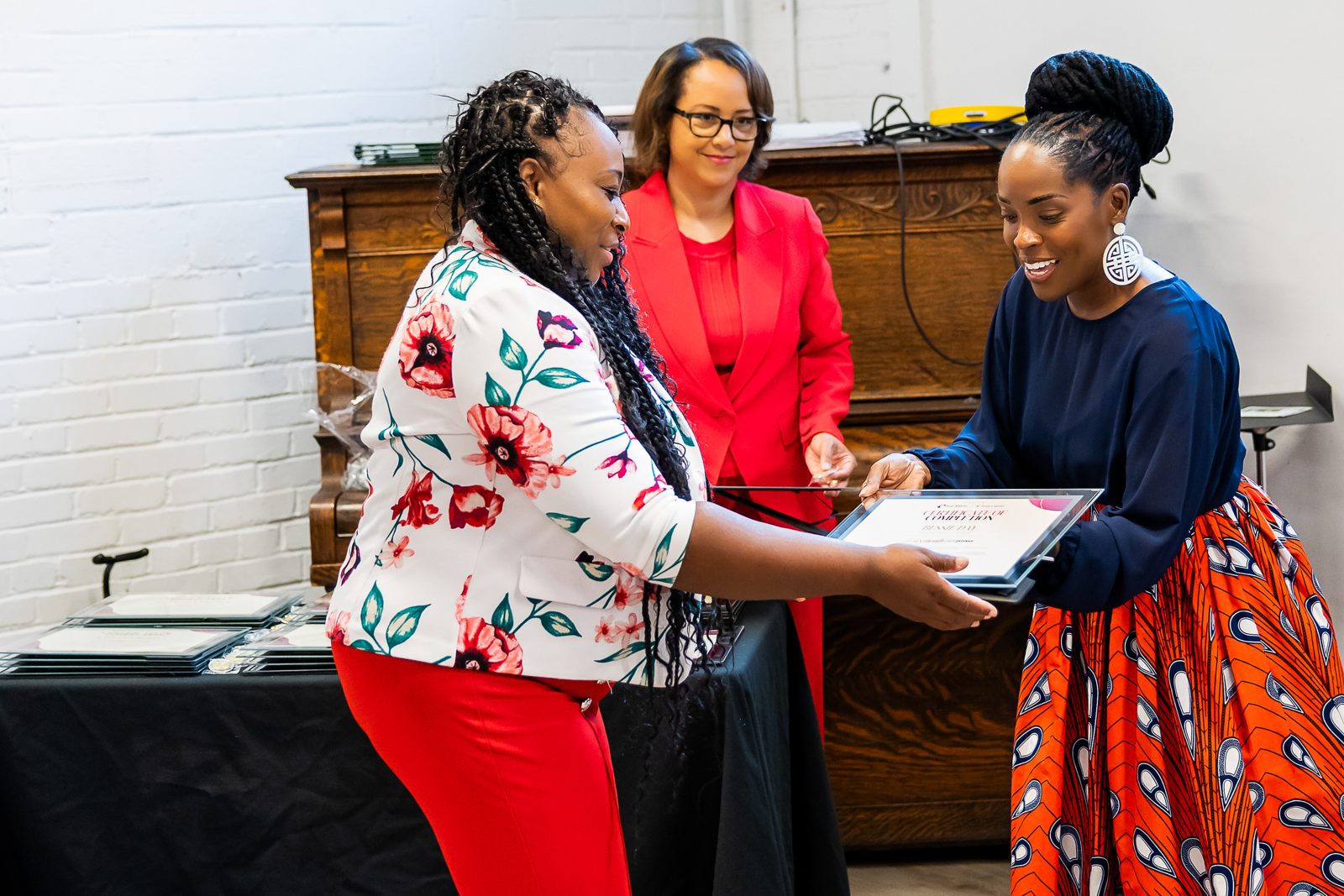 A graduate receiving her certificate