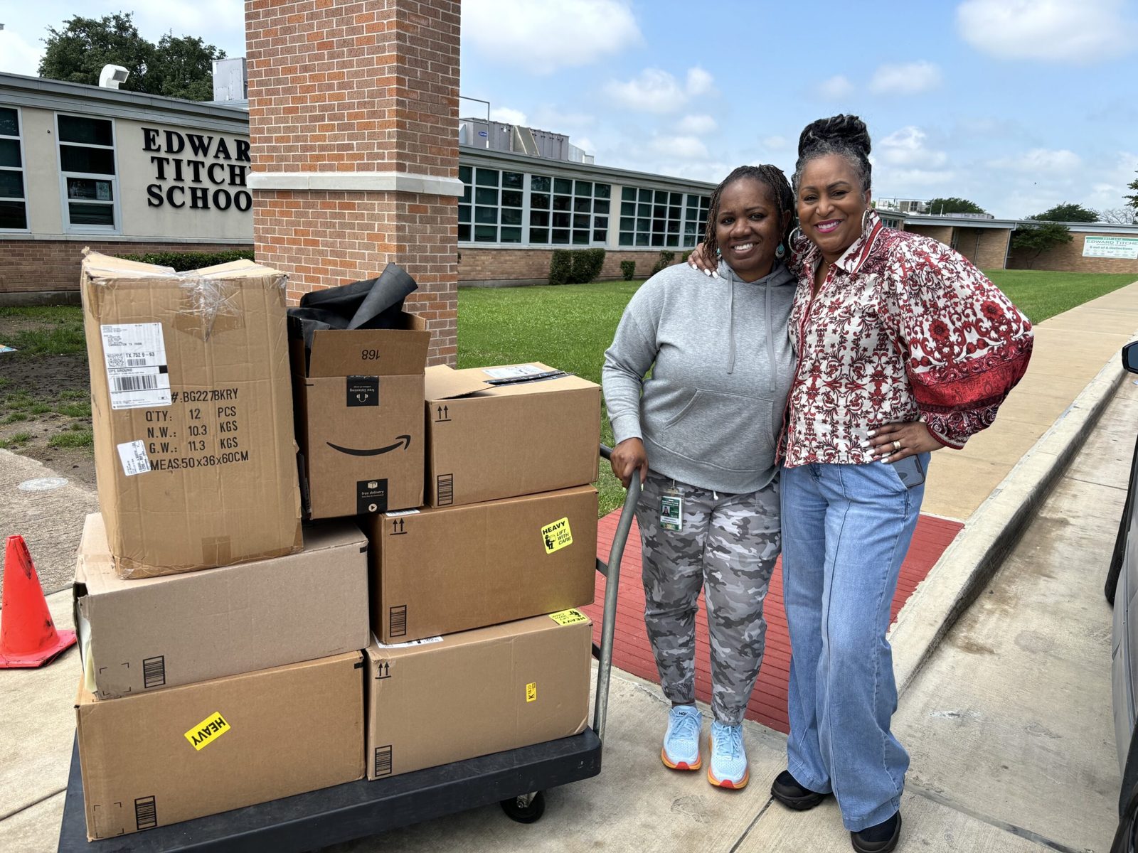 Dr. Cheryl Polote-Williamson delivering boxes of donations to a local school